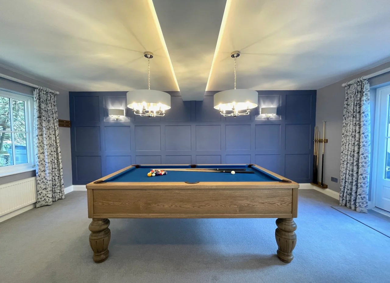 Pool table with panelled wall