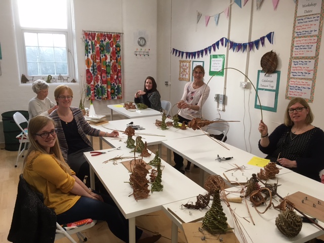 The group with all their creations at the end