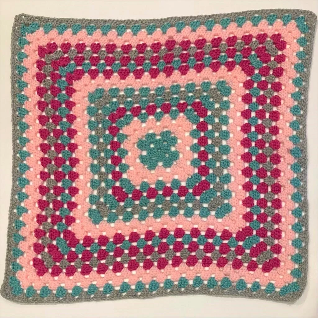 Crochet granny square cushion cover.jpeg