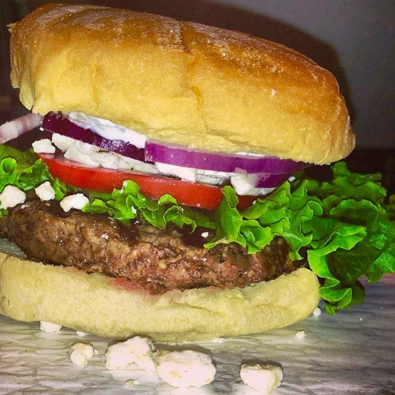 Santorini Bite ❤️ 
Beef burger topped with feta cheese, lettuce, tomato, red onion and tzatziki sauce! #greek #burger #september #bite #burgerbite #longisland