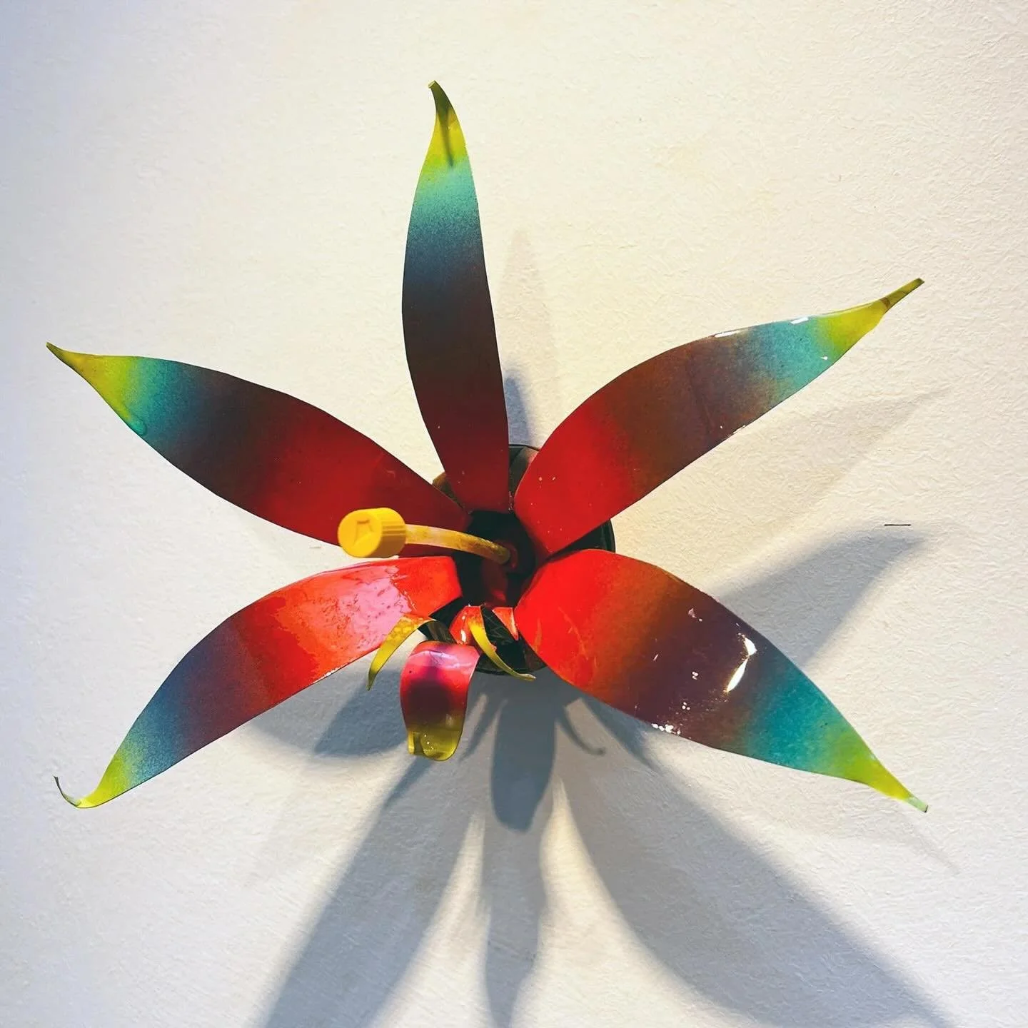 &ldquo;The Dawnpetal Spectra&rdquo;
A true spectrum, each petal fades softly from blushing pink to sunrise orange to deep lavender. The finish is soft-sheen, like mist caught on colored glass.

Lore: First seen at rooftops where graffiti artists watc