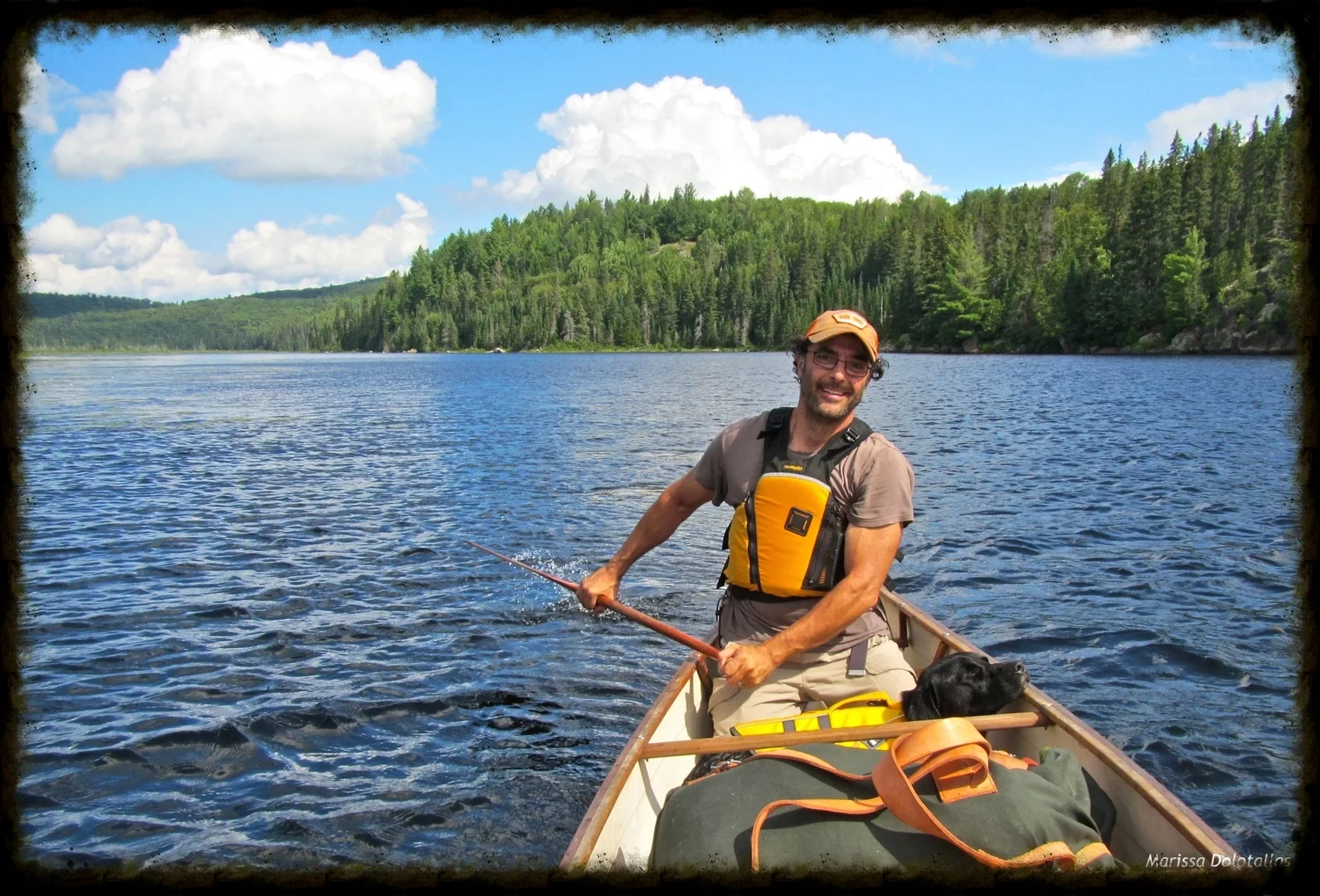 Chris canoe camping with our dog.jpg