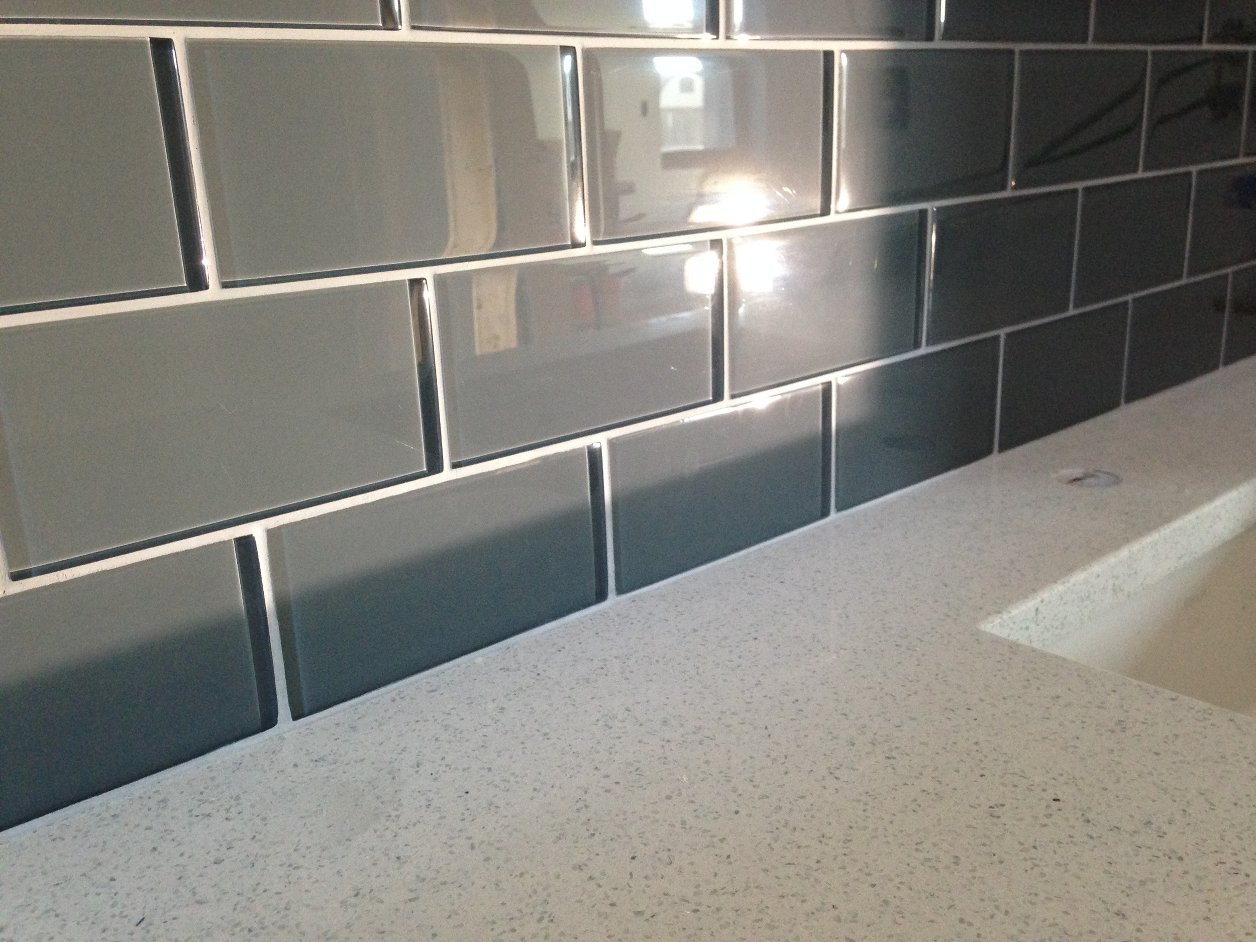  Master bath quartz counter top and glass wall tile 