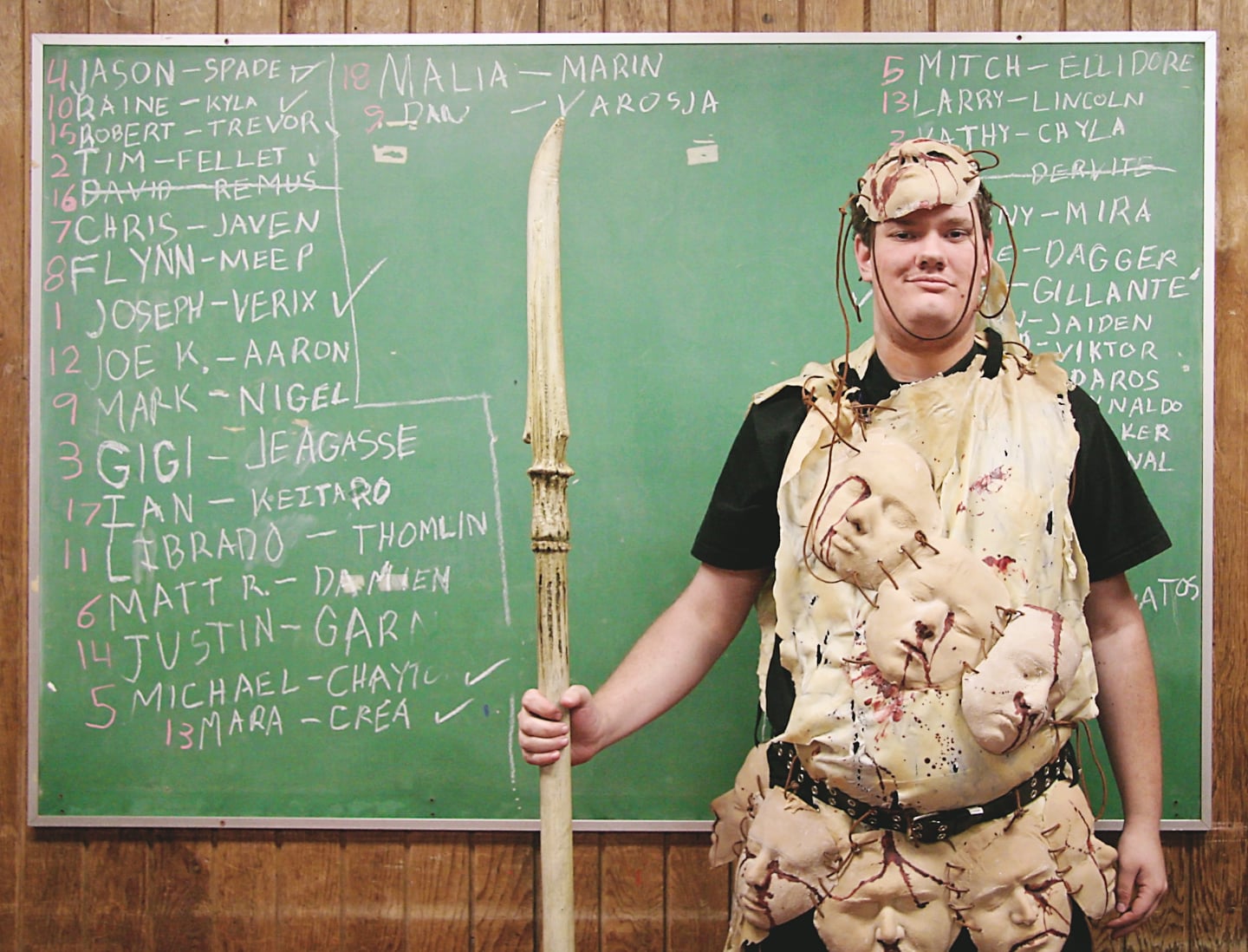 People from all over the world come together to make their fantasies a reality through LARP, or live action role playing. Each person creates a character, then storylines are acted out and battles are waged. Here a participant pauses in front of the board where points are recorded before a battle at an event hosted by NERO West in Santa Cruz, CA. 