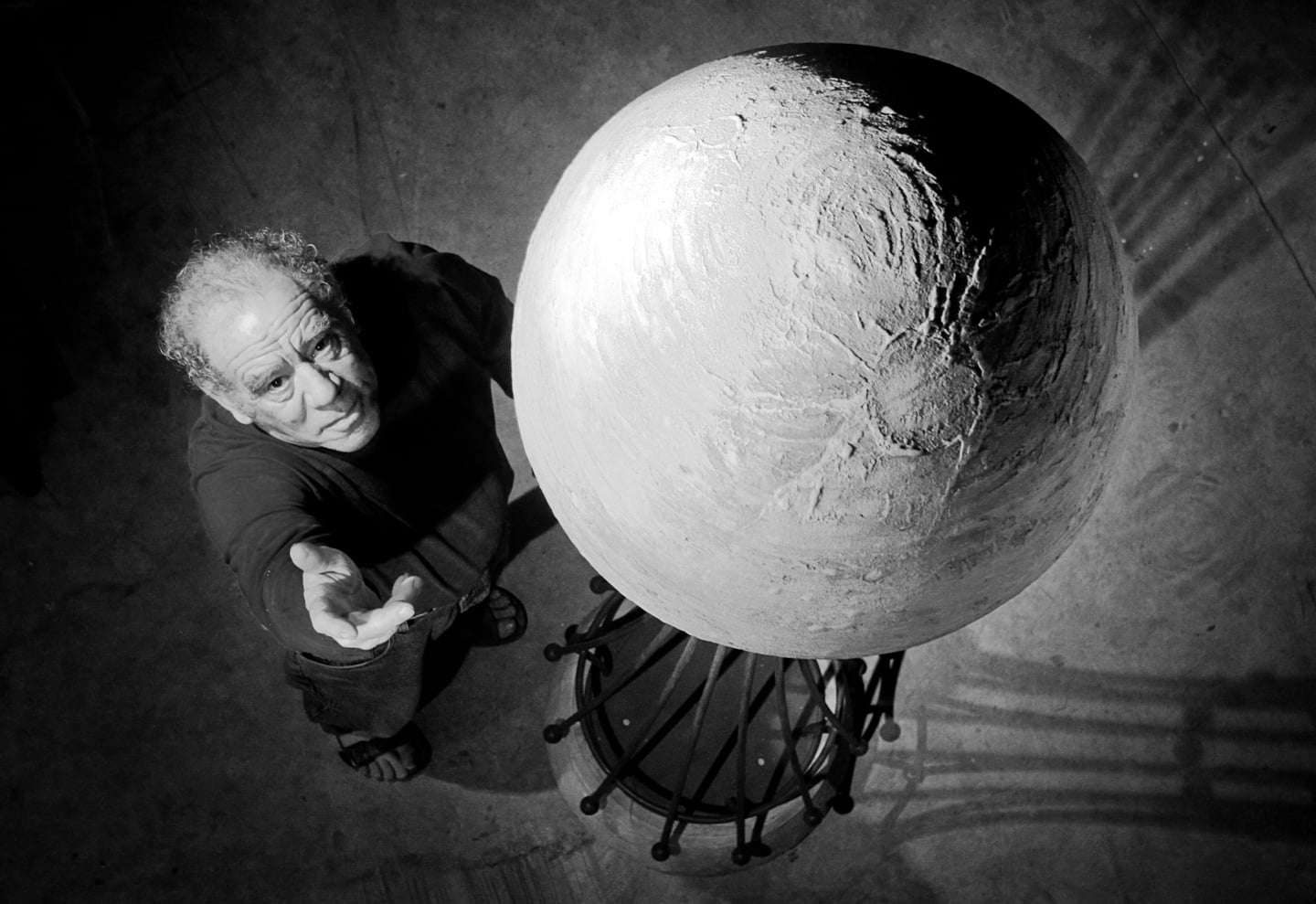 Sculptor Daniel Oberti is shown with his piece Venus as he prepares his studio for Art at the Source in Sebastopol, CA. Oberti has been influenced by spheres since he studied in Egypt and Crete in 1990. Working mostly with ceramic and bronze, he creates pieces that vary, but have this common visual element.
