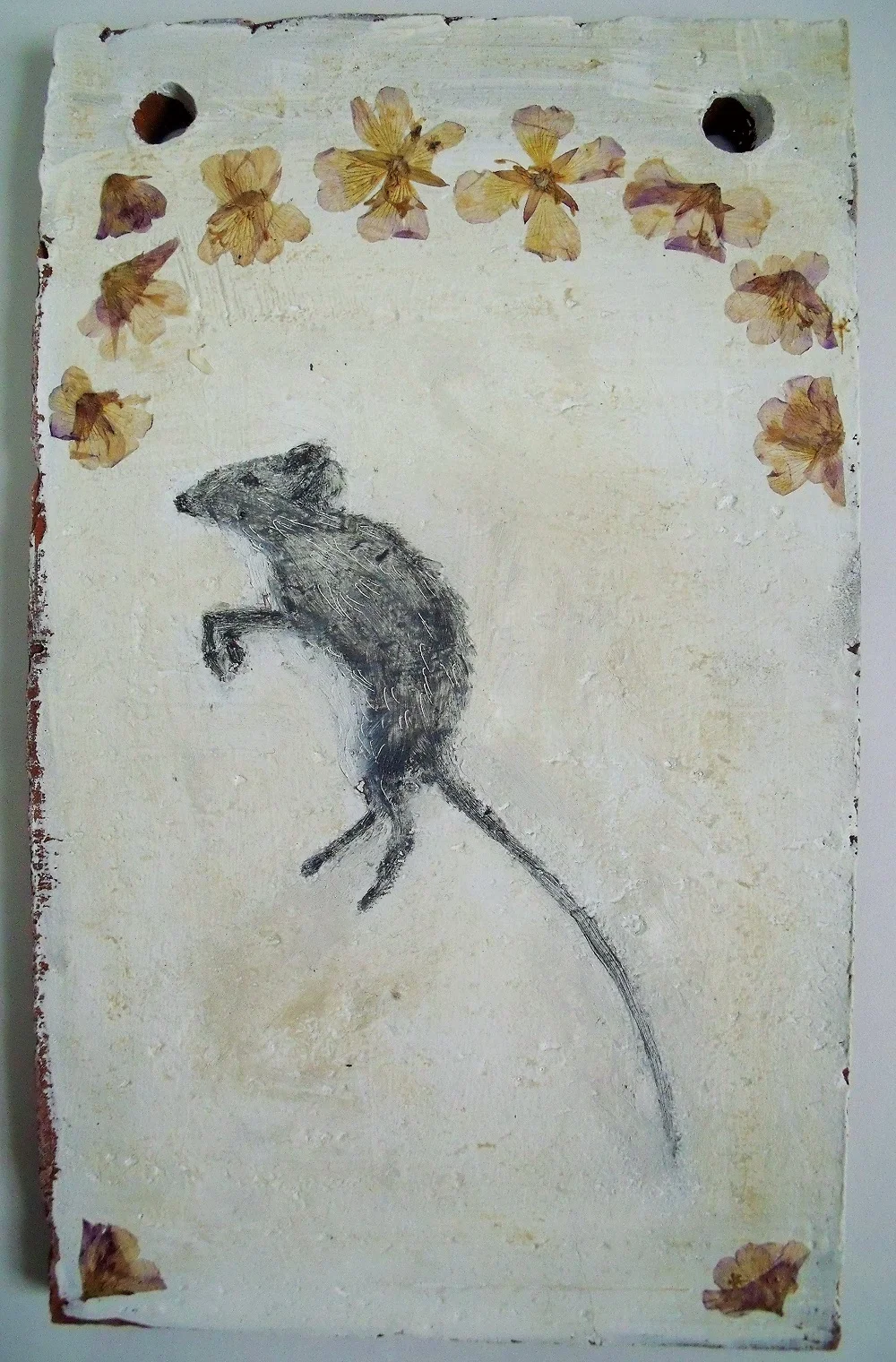 Terracotta tile shrine for a rat with pressed flowers