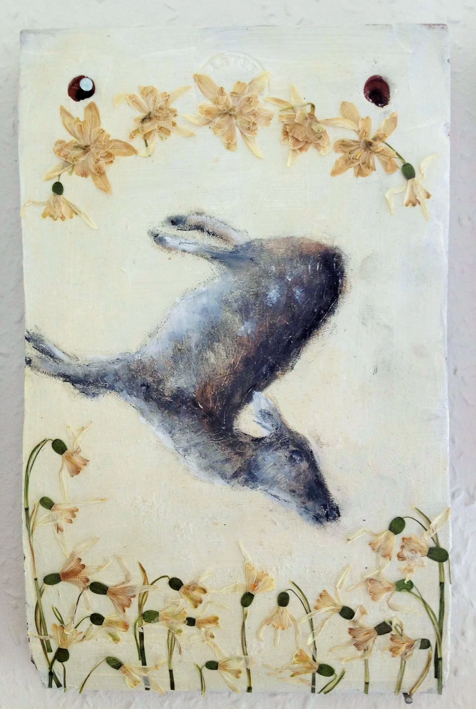 Terracotta shrine for a dead deer with pressed snowdrops