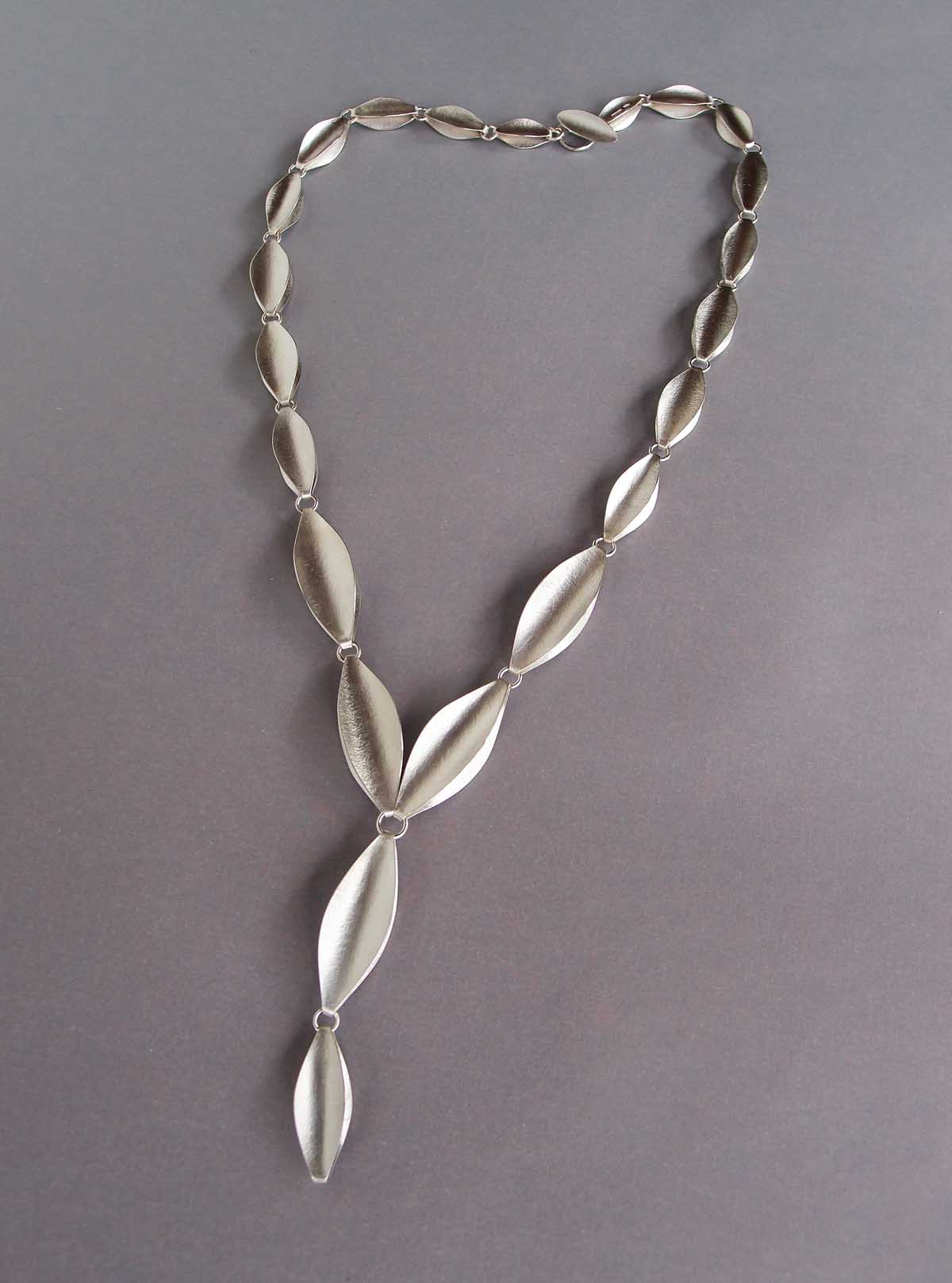Silver shuttle necklace