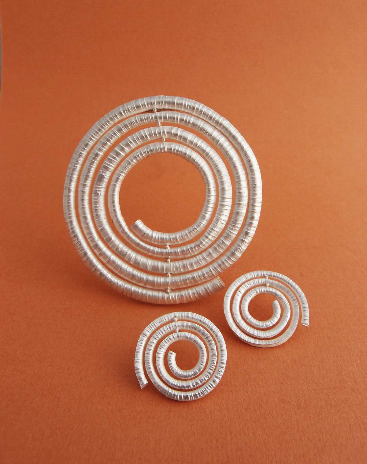 Silver spiral brooch and earrings