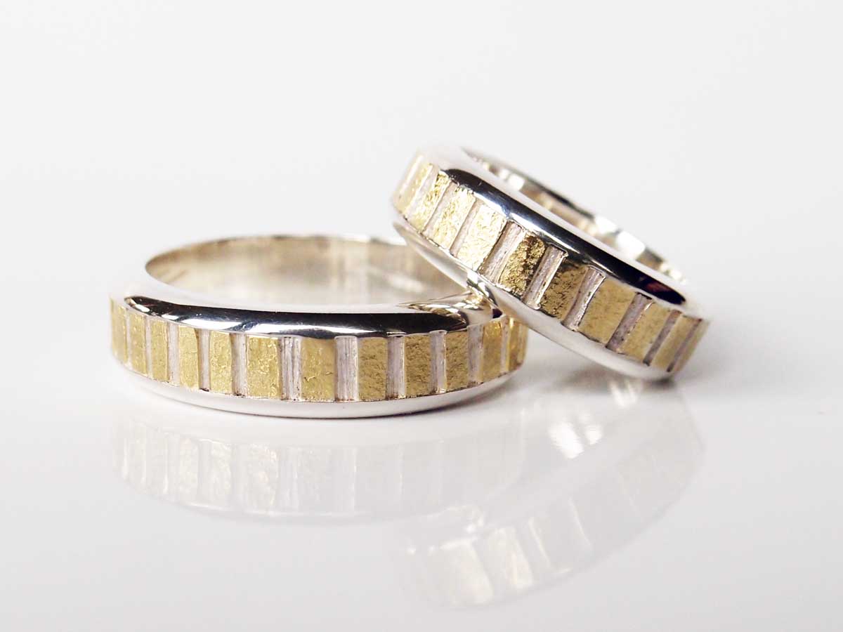 Silver and 18ct. gold rings