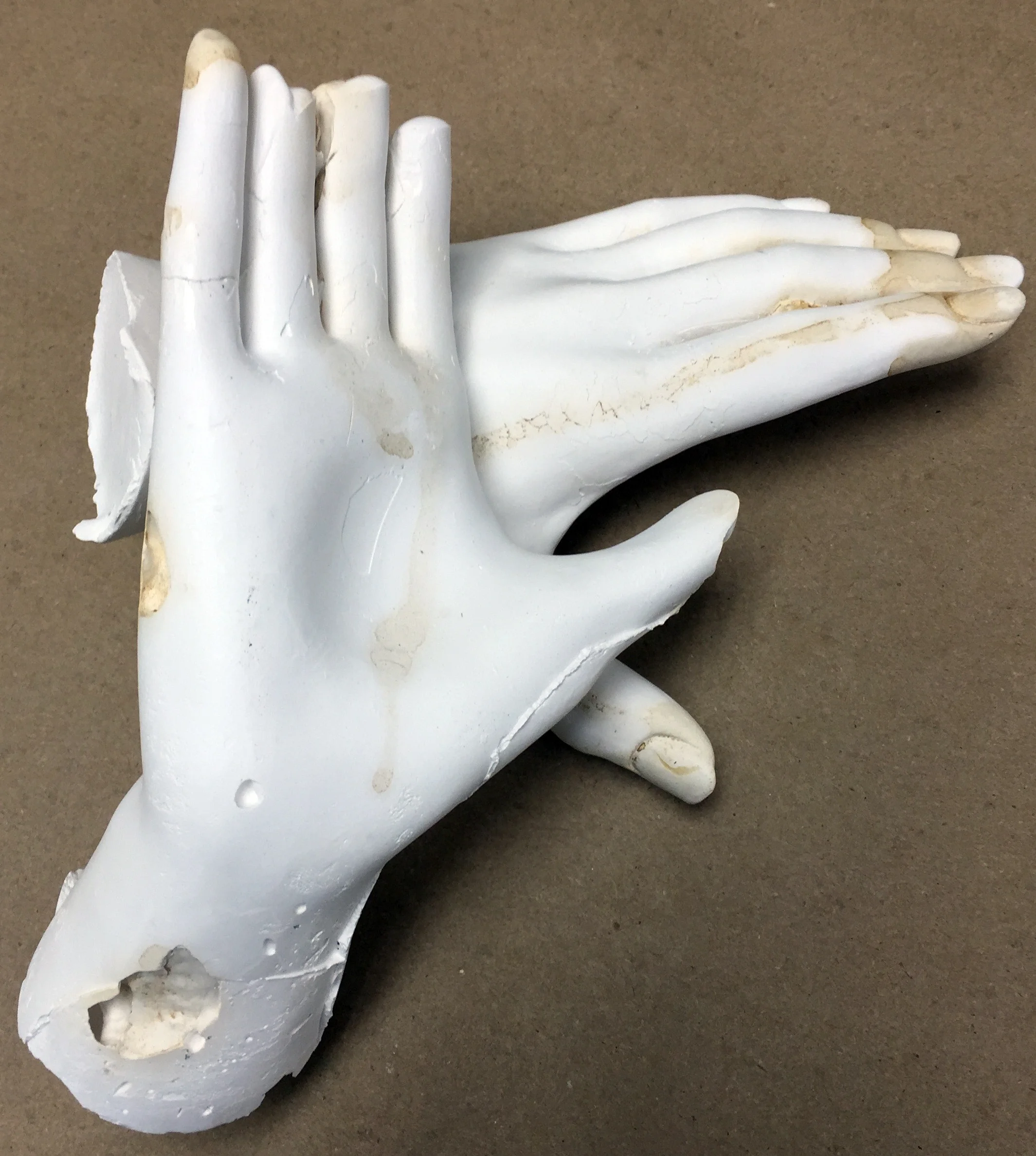 Plaster hands with tobacco stain