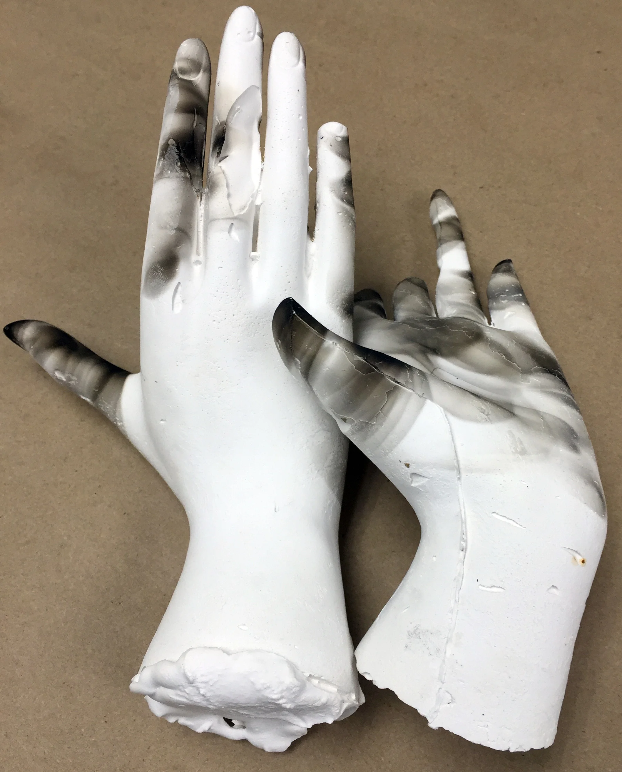 Plaster hands with smoke