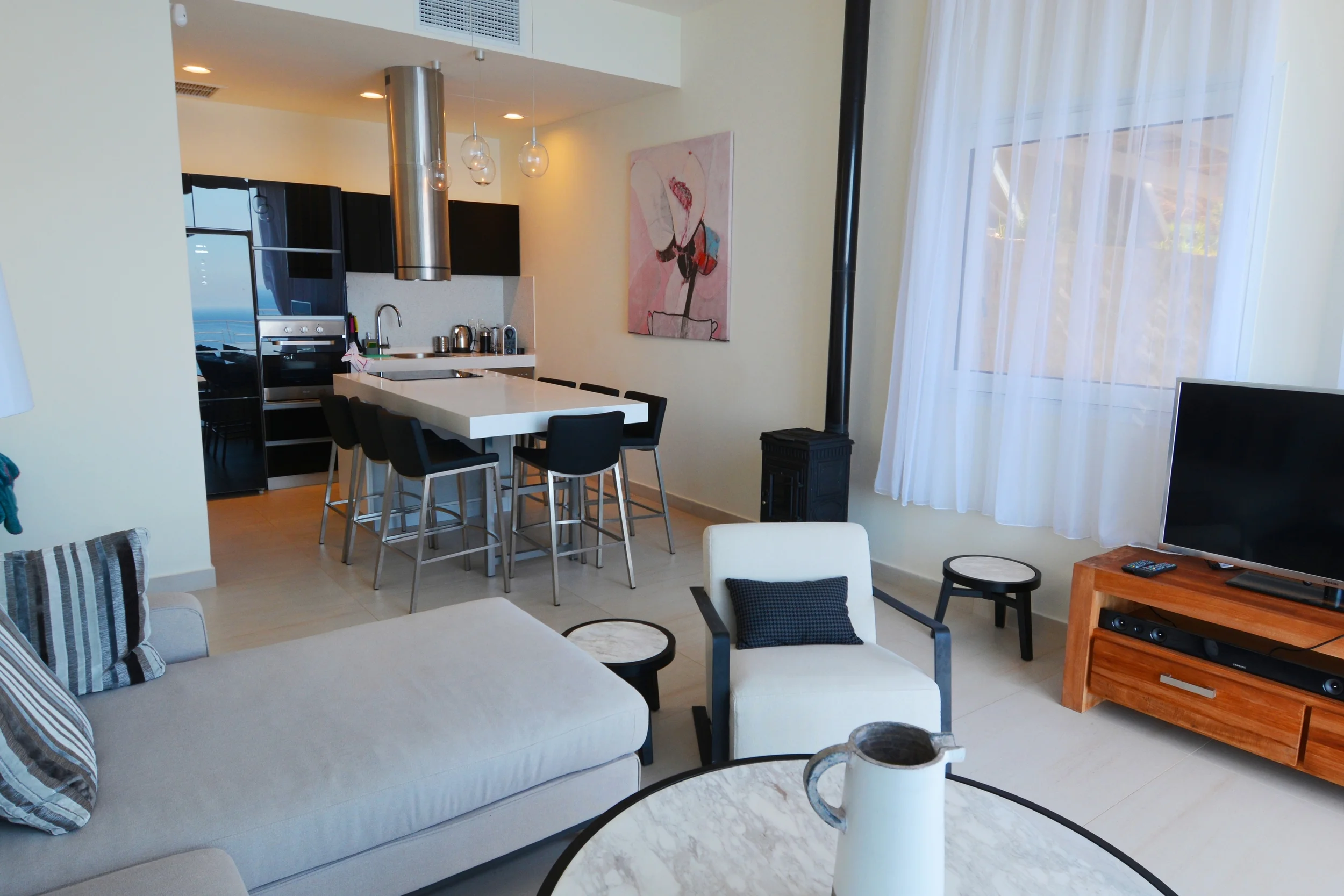 Stylish living rooms and a well equipped modern open kitchen.