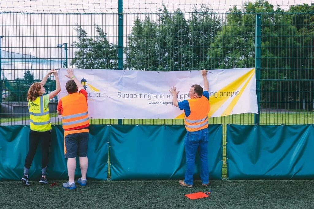 Getting the Solas Project banner up; ‘Supporting and equipping young people’.