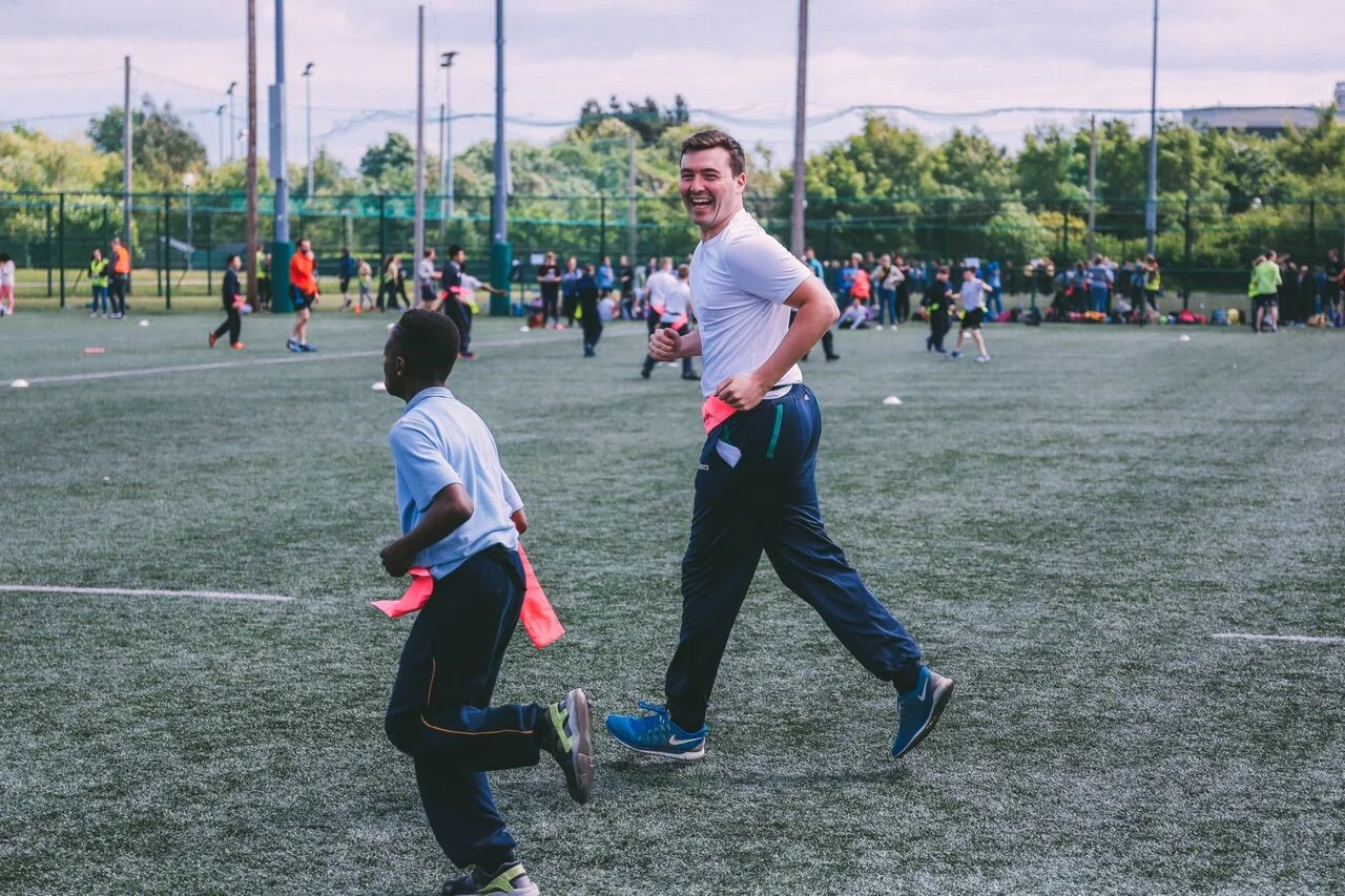 Volunteer from Savills getting their team warmed up.