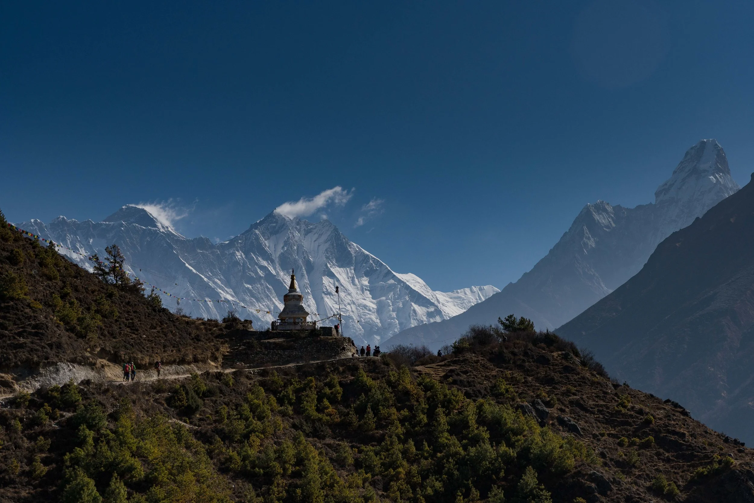 First Views of Sagarmāthā (top left of photo)