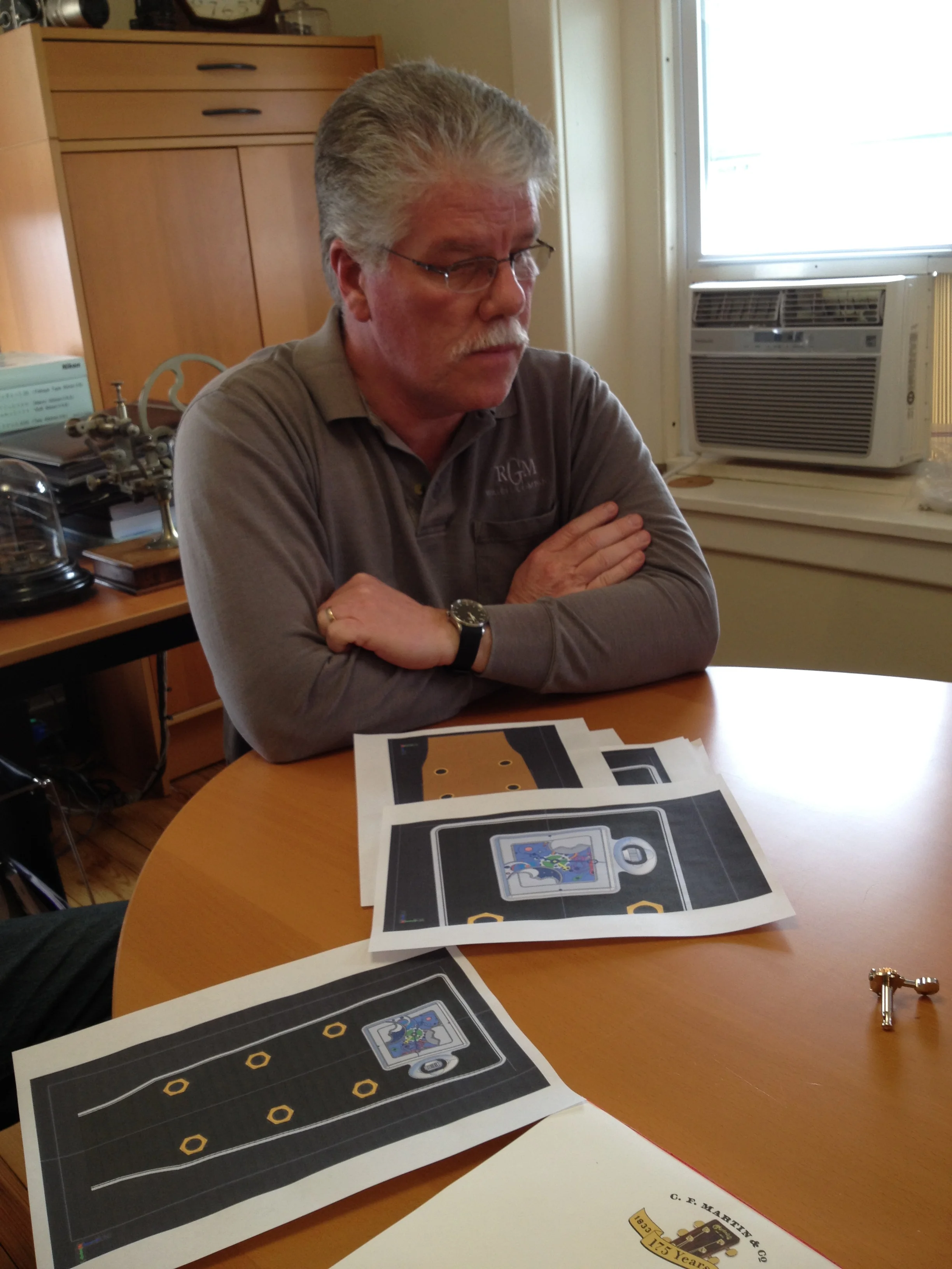  Roland inspecting placement renderings for a one-of-a-kind movement and housing to be mounted within the head stock. 