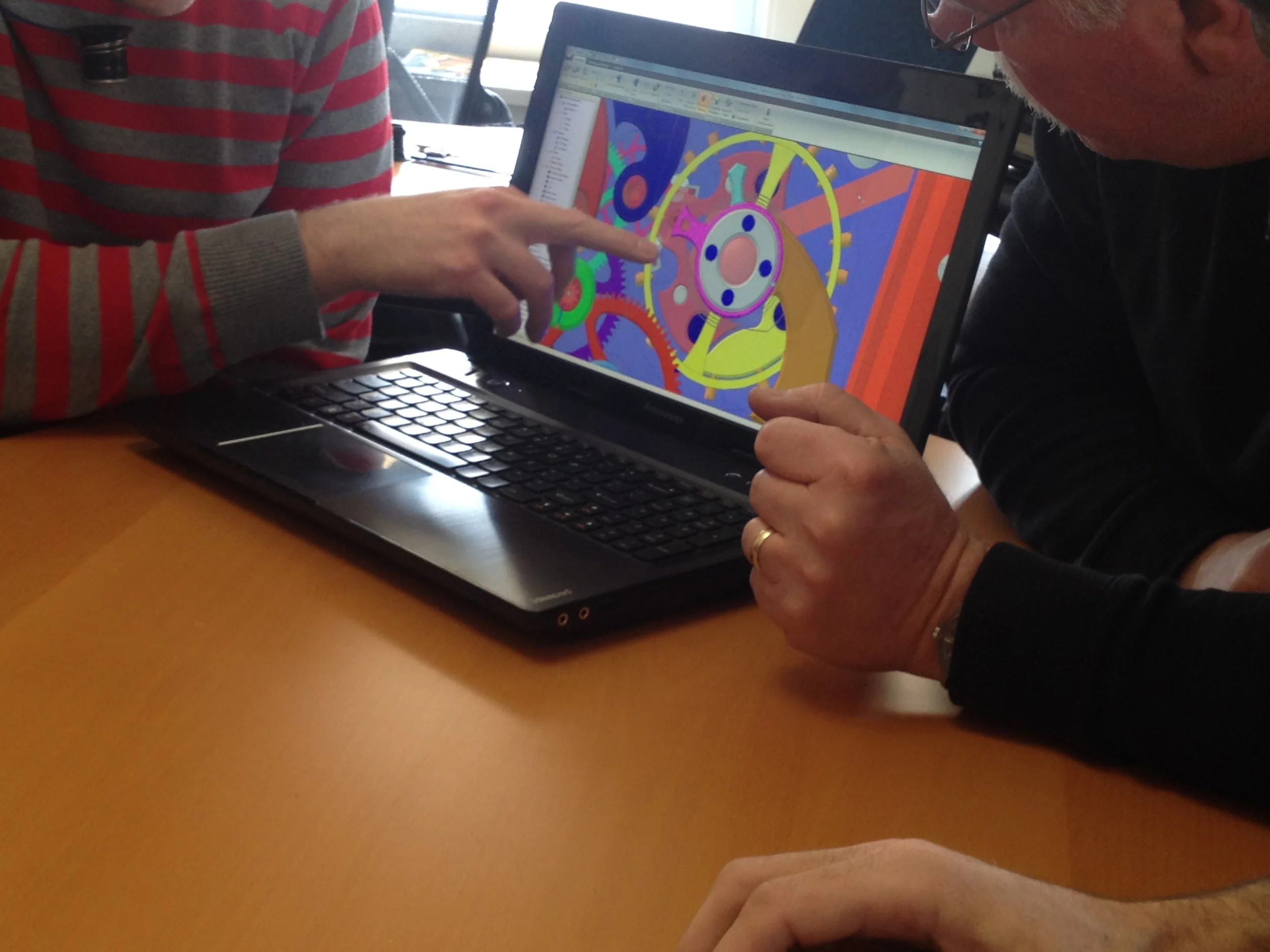  Individual components from a working timepiece are evaluated for layering into a guitar using emerging new techniques.   