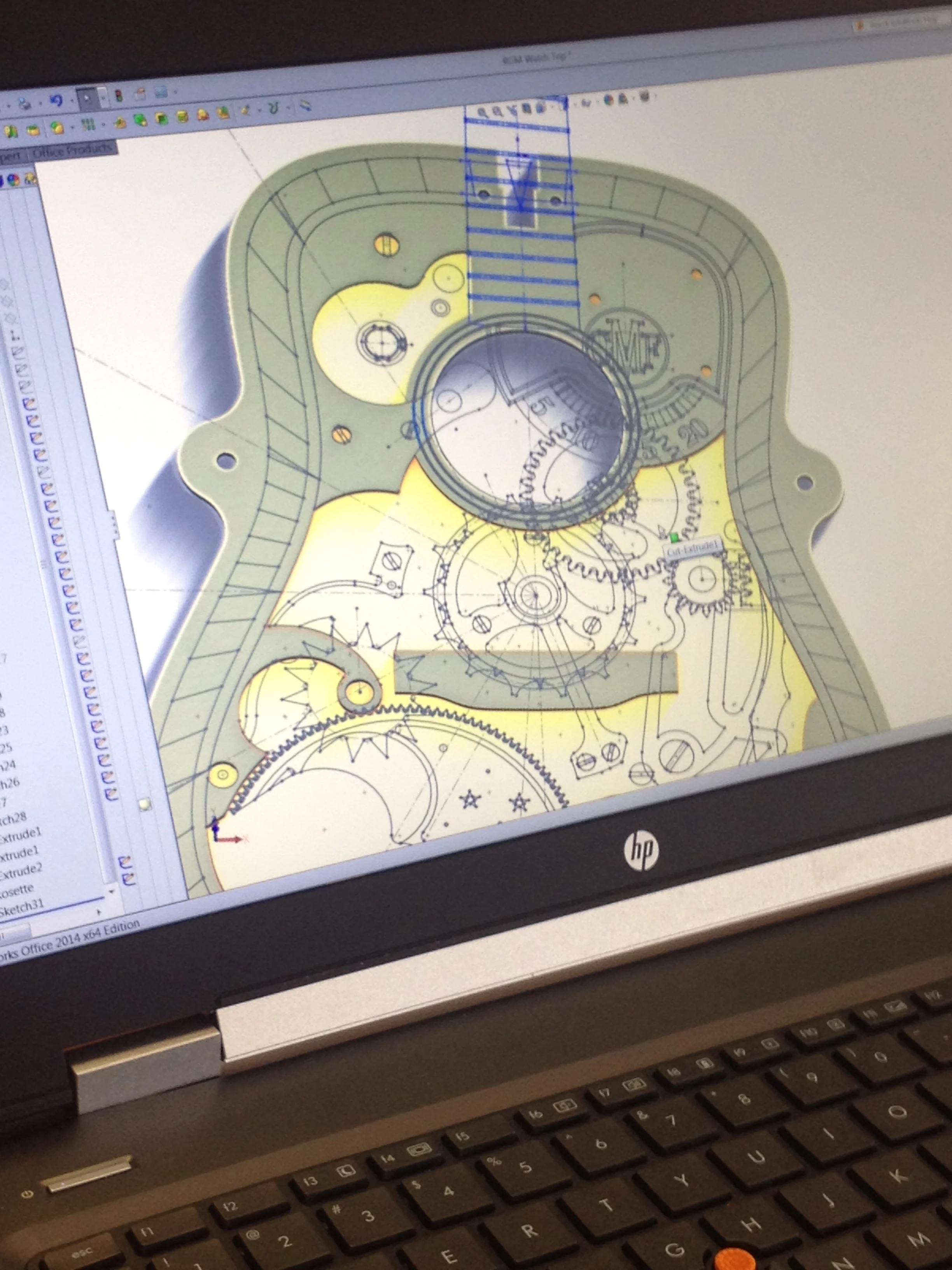  Continued modelling shows the concept of building a watch "through" the guitar.&nbsp; The pieces on top relate top down through the gear train of a working timepiece. 