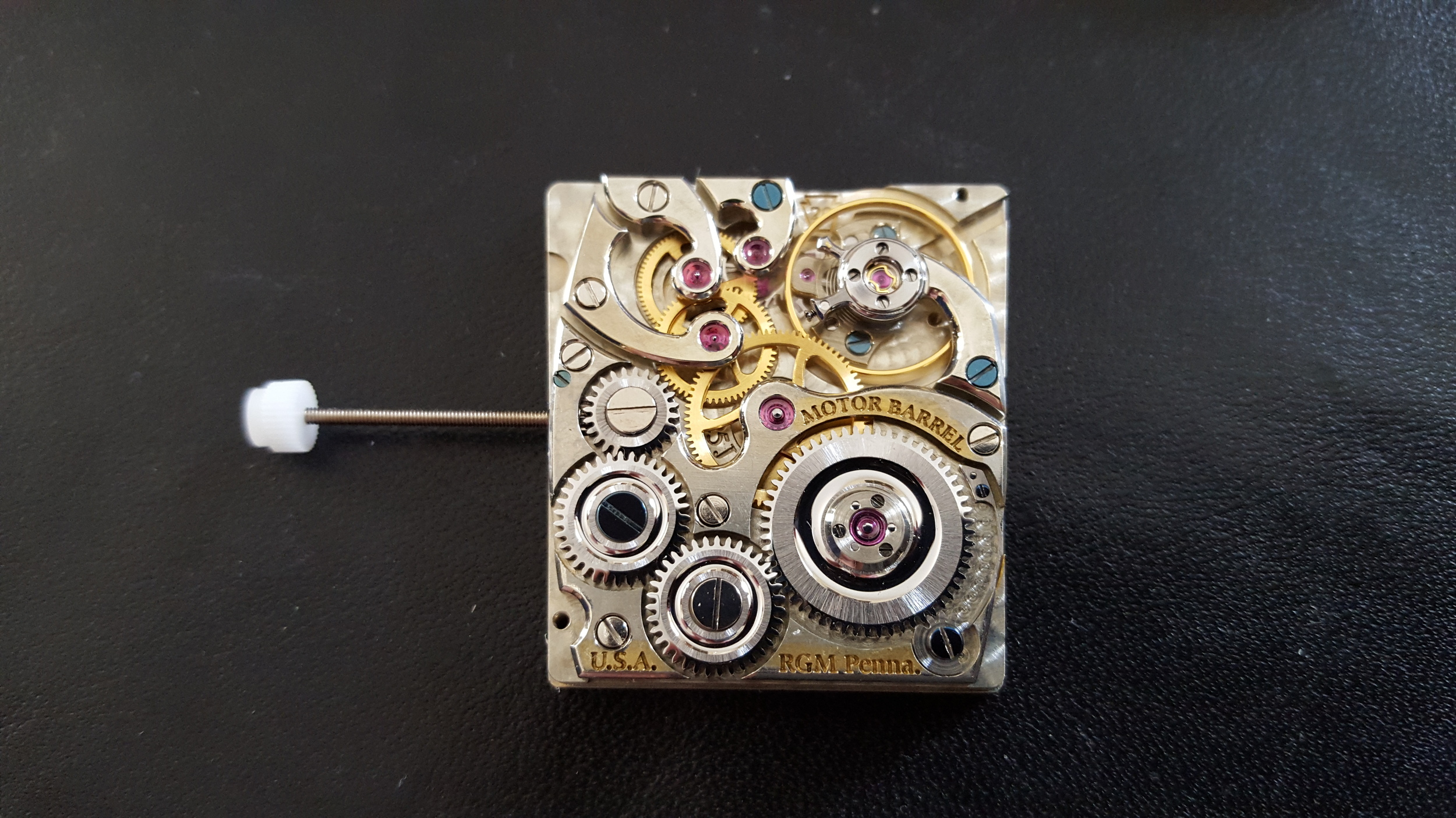Actual watch movement from test production ready for extreme scrutiny, quality evaluation, and additional dressing of components.