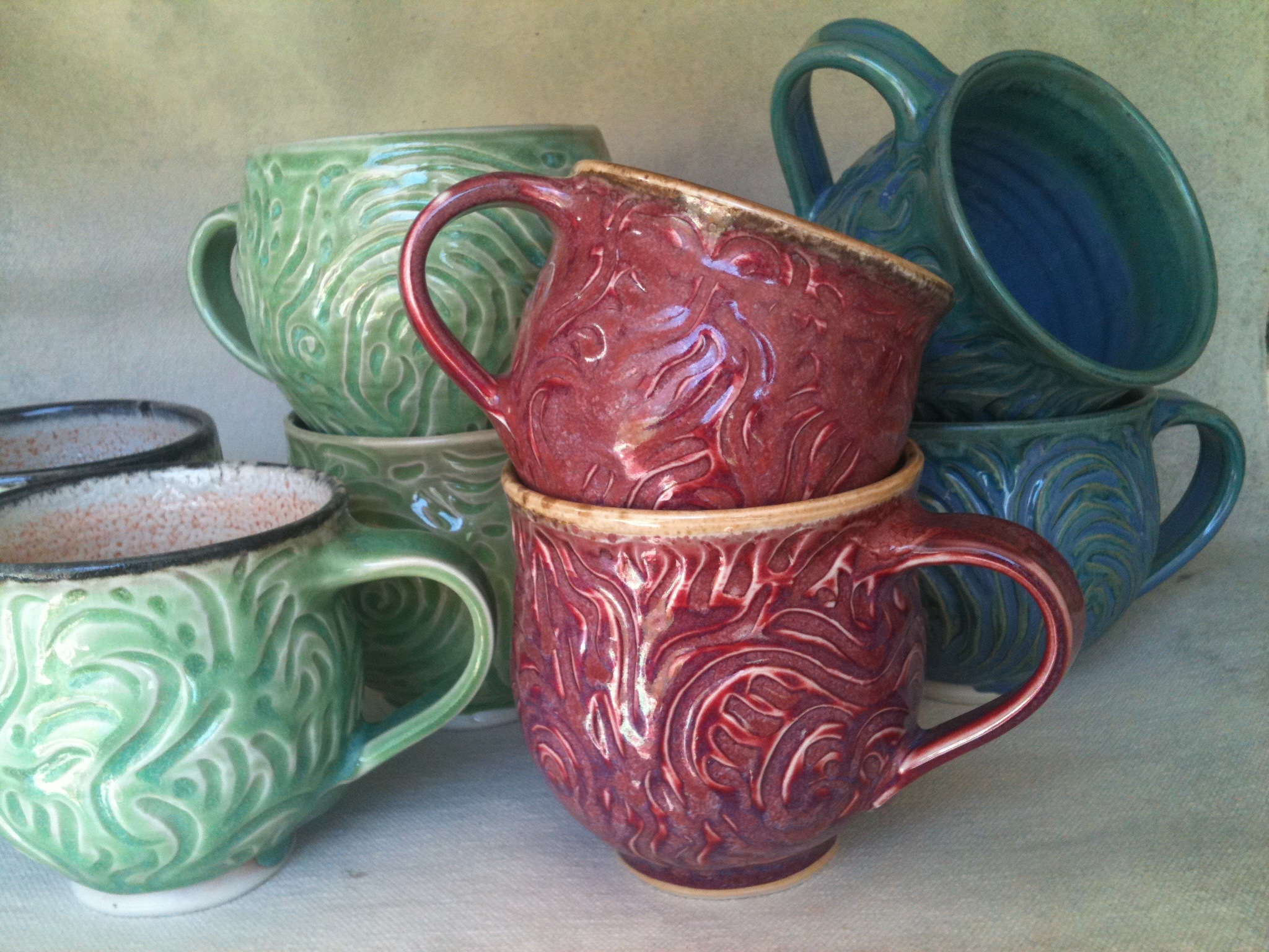 Carved porcelain mugs