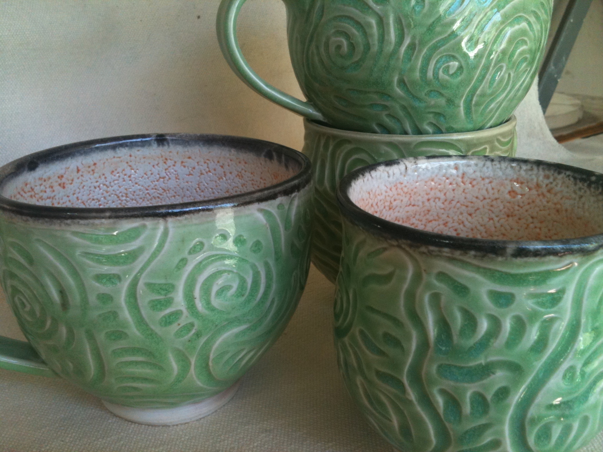 Carved porcelain mugs
