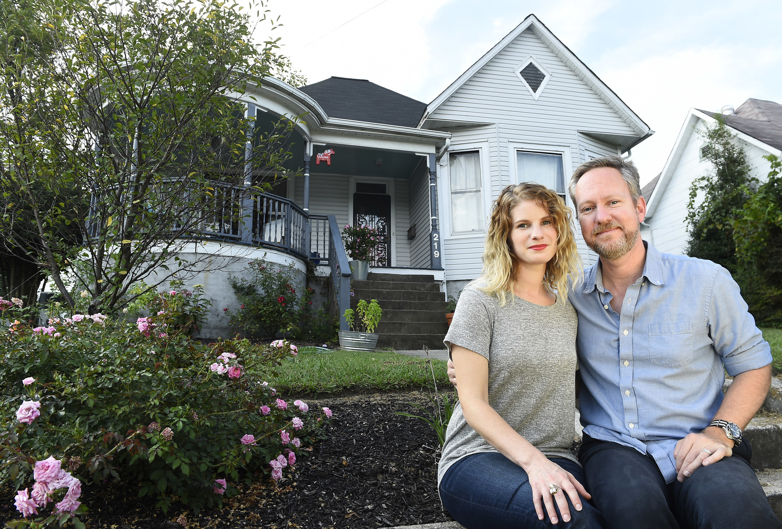 Dale Mackey, left, and her husband Shawn Poynter outside of their home in north Knoxville. The couple rents out space in their home through the Airbnb.com website.