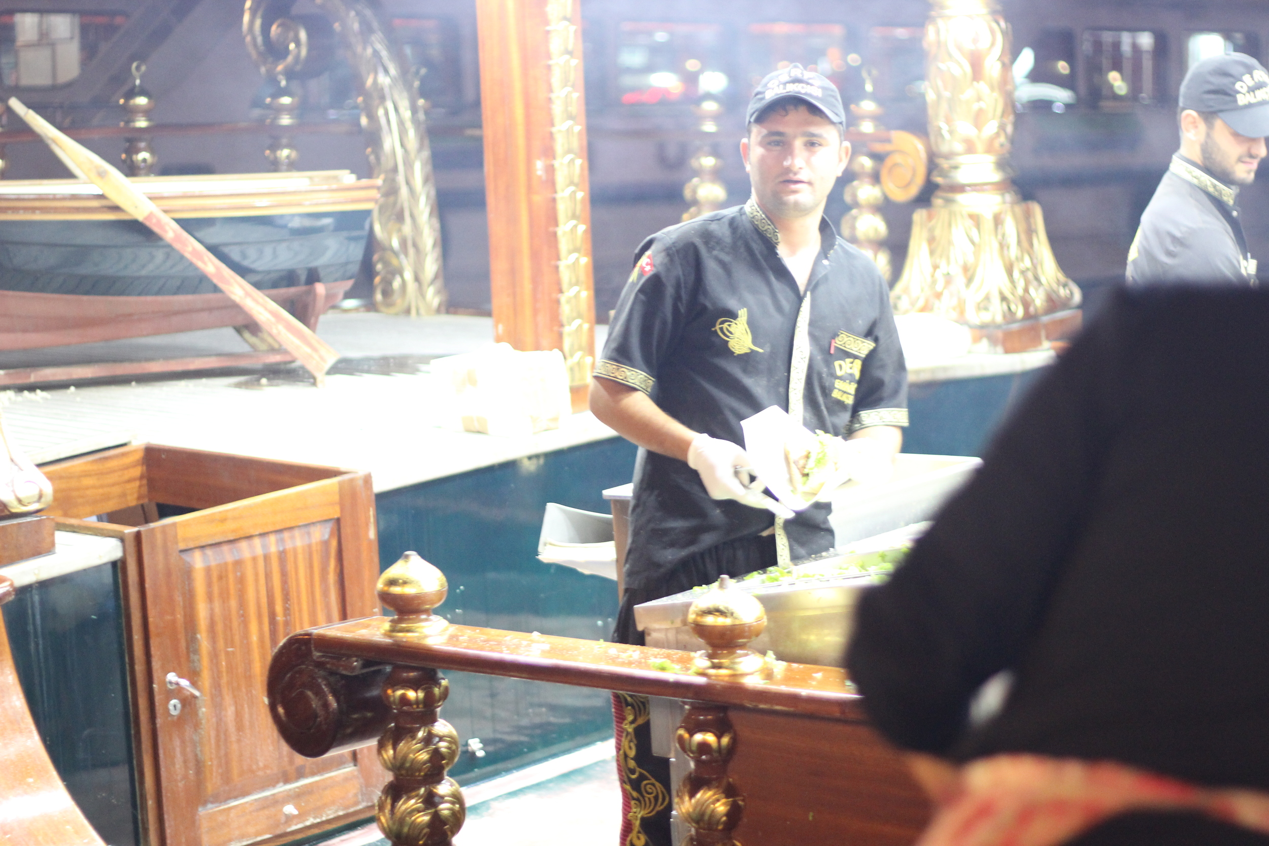 Fishbread fishman under the Galata Bridge   --   Istanbul, Turkey
