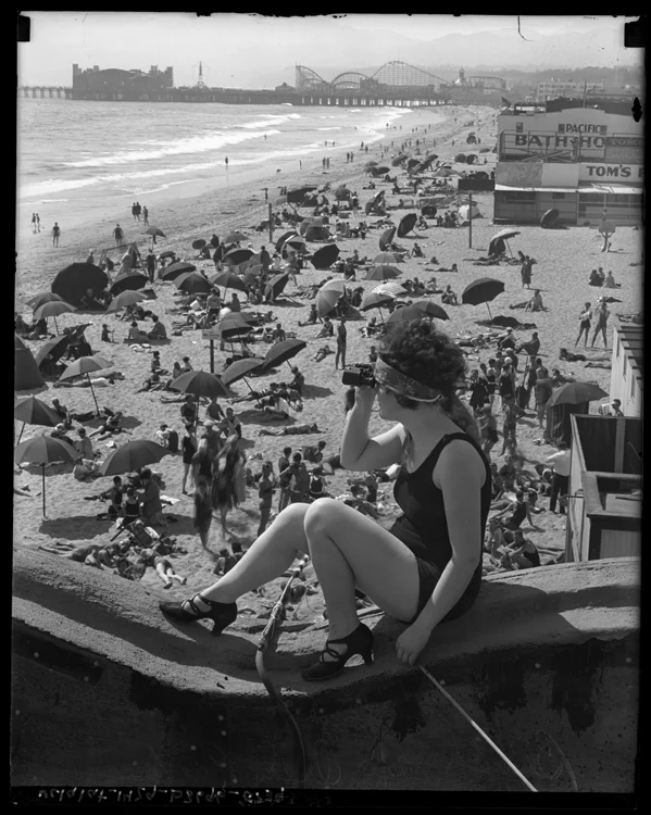 latimes:

A woman sits with a spy glass, looking out at Santa Monica Pier, circa 1920.
Our Vintage Times series is presented on Tumblr with photography from the Los Angeles Times archives.
Today is the first day of summer. Are you ready?