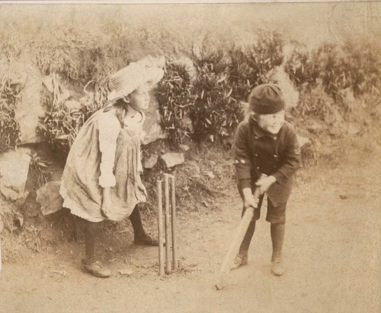 my-ear-trumpet:

daysrunaway:

A feisty Virginia Woolf and her younger brother Adrian play cricket in this picture as their parents watch from the porch at Talland House. In his memoir, Leslie Stephen says, “we made what we called a ‘lawn tennis’ gr…