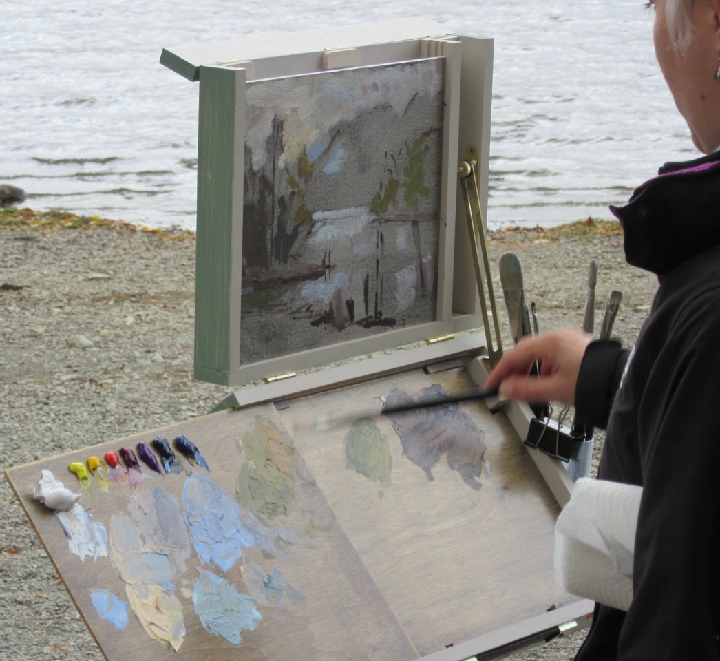 After thinly sketching in the darks, it's time to move onto blocking in the large masses of sky, water and fells