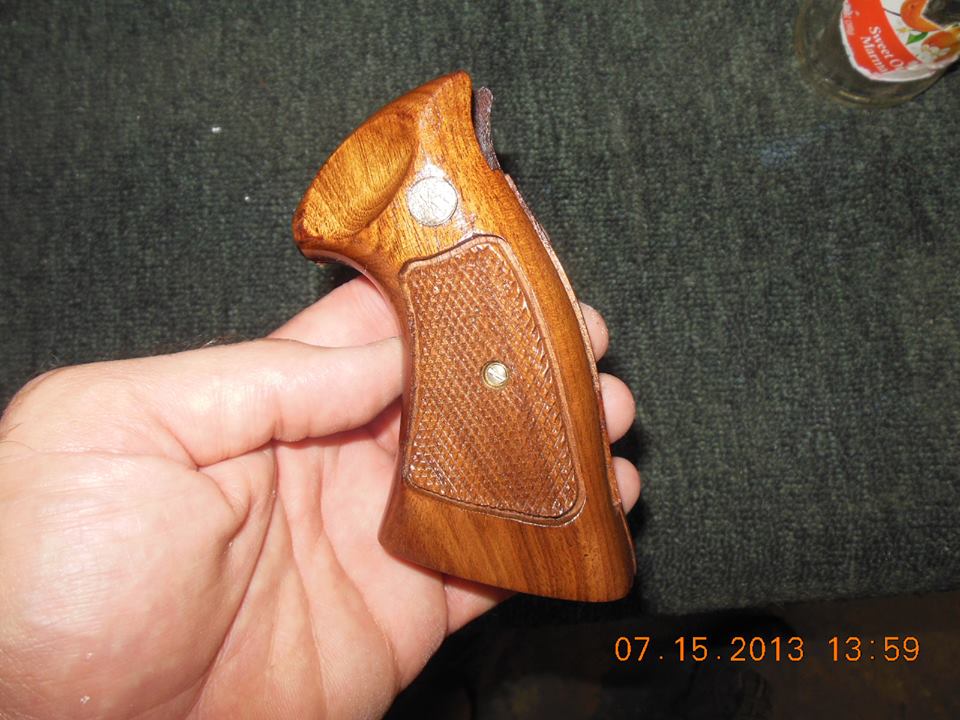 just finished refurbishing and repairing Walnut pistol grips for a gun collector client of mine. They turned out very nice..jpg