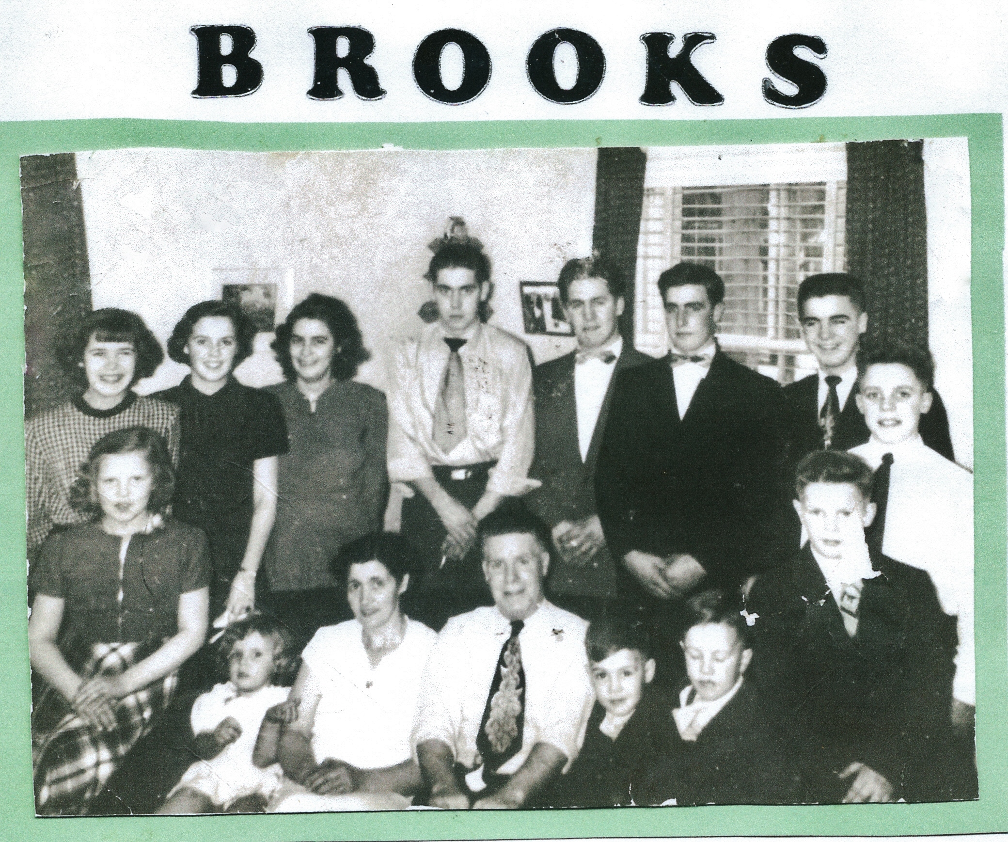 George & Daisy Brooks with their 13 children on the occasion of their 25th wedding anniversary, 1950 Daisy Smith Brooks and George Charles Brooks, parents, sitting on the couch.....Left side of Daisy, listing the youngest girl to the oldest as: Sylvia, Brenda, Jean, Evelyn and Winifred. Right side of George, listing the youngest boy to the oldest: Kenneth, Victor, Harry, Jim, Tom, Stan, Sid and Bob.