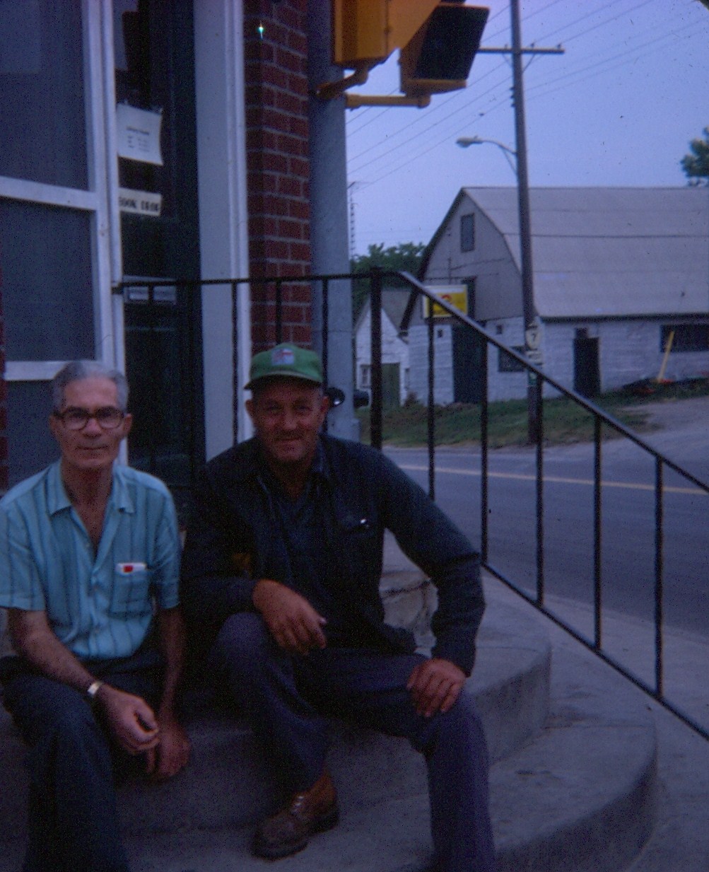 Hanging round the Library steps, 1977 bernard Forbes on the right. The fellow in the blue shirt is Kenny Hartin, brother Dave Hartin who lived on the Beaver Creek Settlement Road.