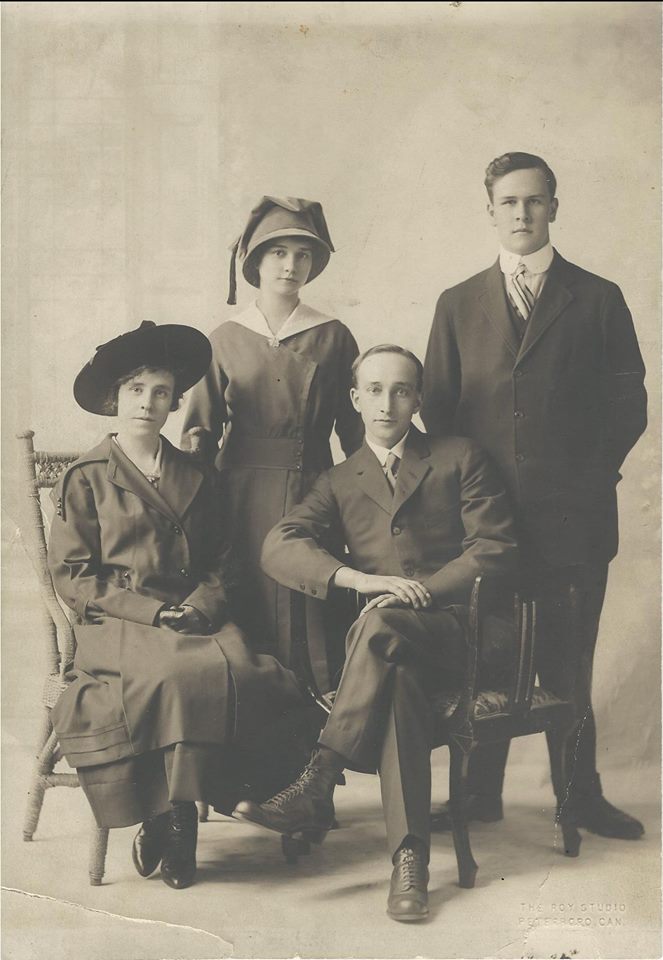 Ada and Frank Sweet in front and Bess Sweet and George Froats in back. Ada and Frank's wedding according to the note on the back.
