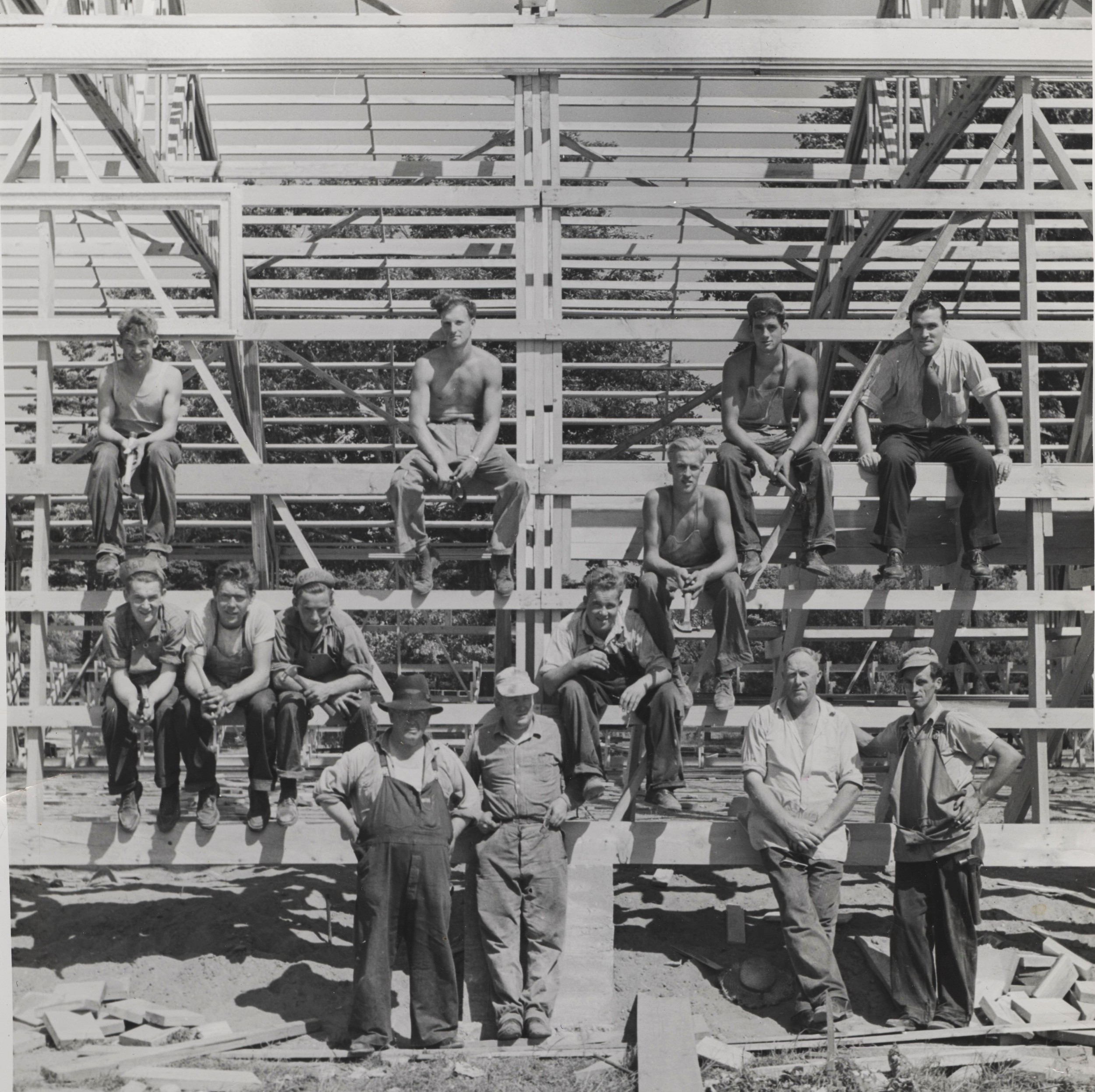 BUILDING THE FIRST ARENA 1948 Top l - r - Robert maynard (contractor's son, ray black, ed waddle, bill shannon, SECOND ROW : DOUG WHAN, THIRD ROW L-R: aLLAN MAYNARD (CONTRACTOR'S SON), mURRAY MCKINNON, GEORGE MAYNARD (CONTRACTOR'S SON), ALFRED MAYNARD (CONTRACTOR'S SON) FRONT ROW L-R - gEORGE hENRY mAYNARD (CONTRACTOR), MARK MAYNARD (CONTRACTOR'S SON), iRVIN mCCOY (FATHER OF mARJORIE MCFAUL) JIM CRAWFROD (FATHER OF JANET O'NEILL)