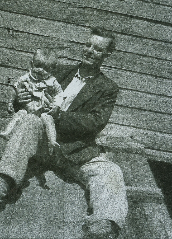 Dr Graeme Squire Mackechnie, son of Dr. Wiliam Greame Mackechnie born 1904, holding his eldest child, Ron.