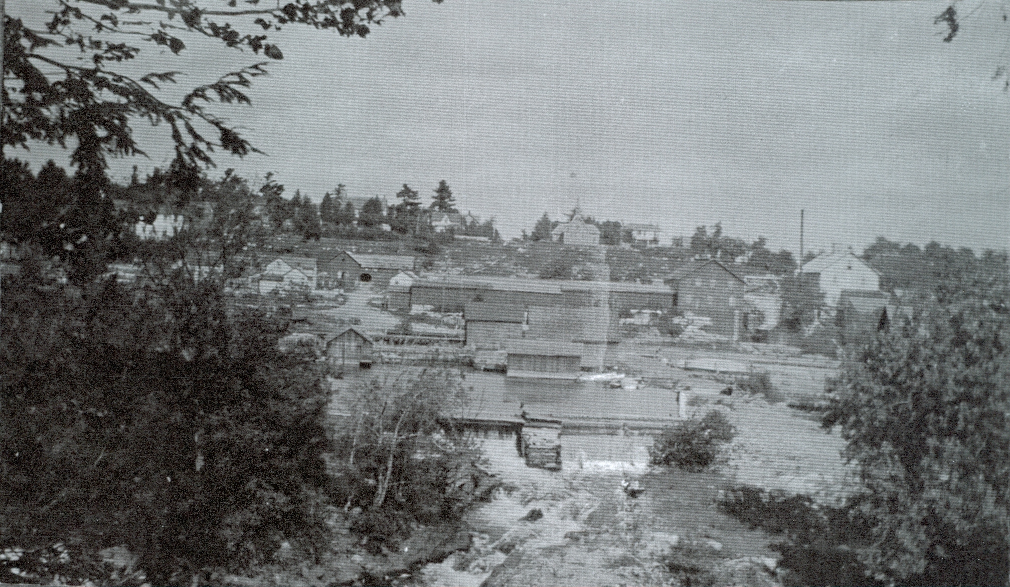 View looking east across the river. Note the angle of the dam, the church at the top, the grist mill on the right