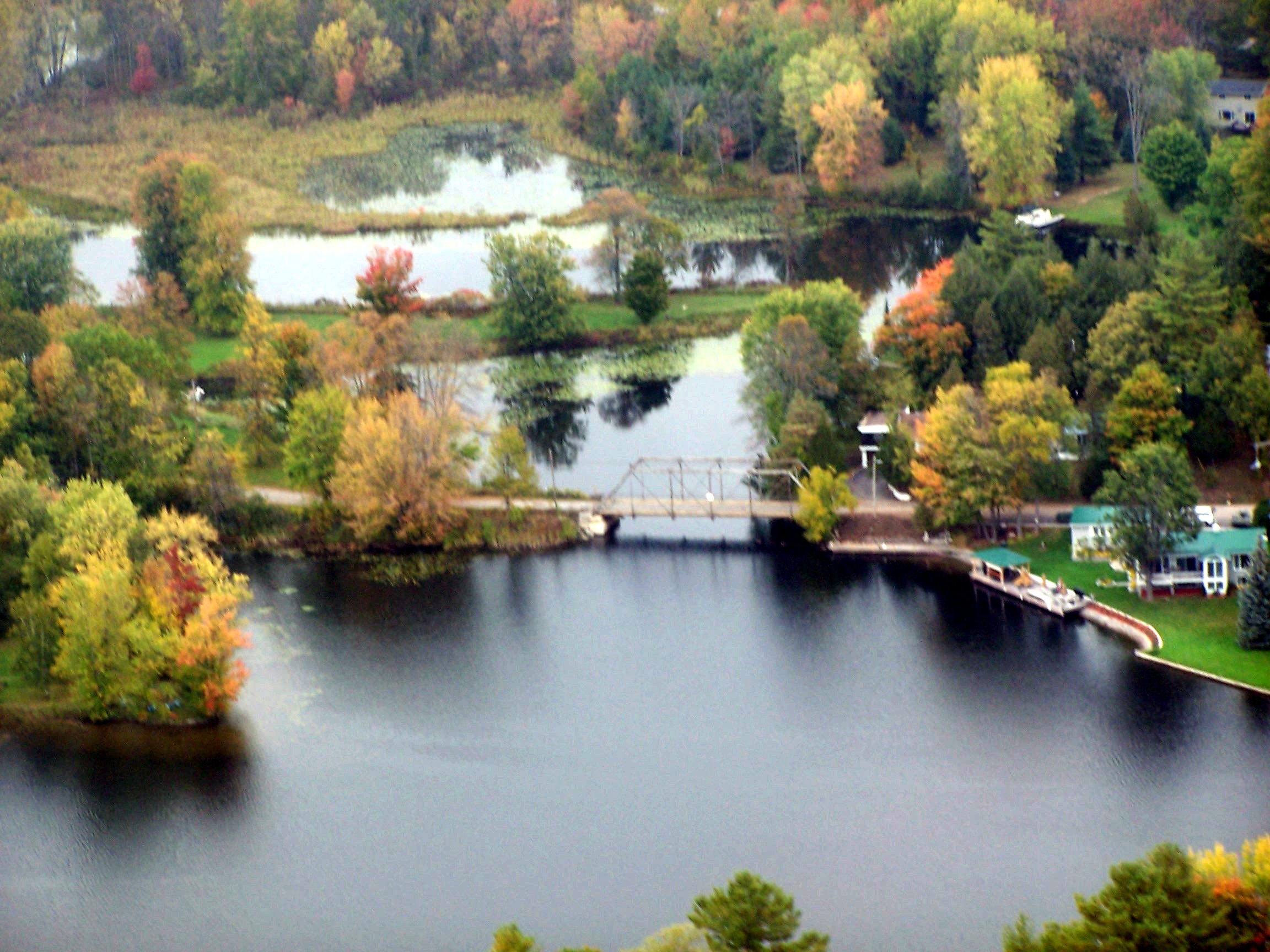 Aerial view of the junction of beaver Creek and Crowe River, showing the old bridge