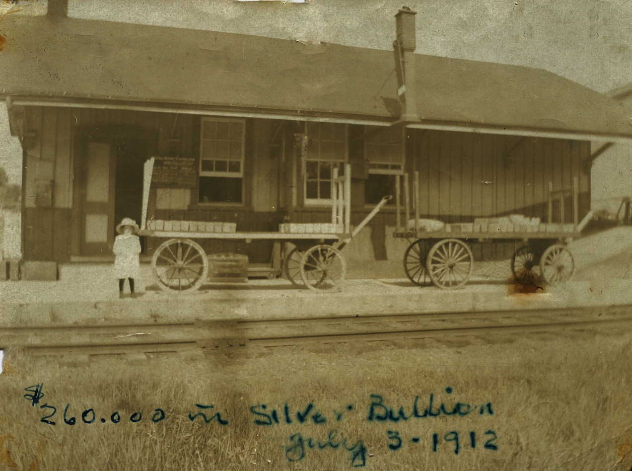 gRACE WARREN ON THE WOLFE STATION PLATFORM AWAITING HER TRAIN, ALONG WITH $260,000.00 IN SILVER BUILLION FROM dELORO
