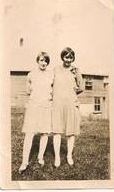 Mildred (later campion) and Marguerite Finnegan (later sister mary bernard), , daughters of John Finnegan. standing outside the cheese factory