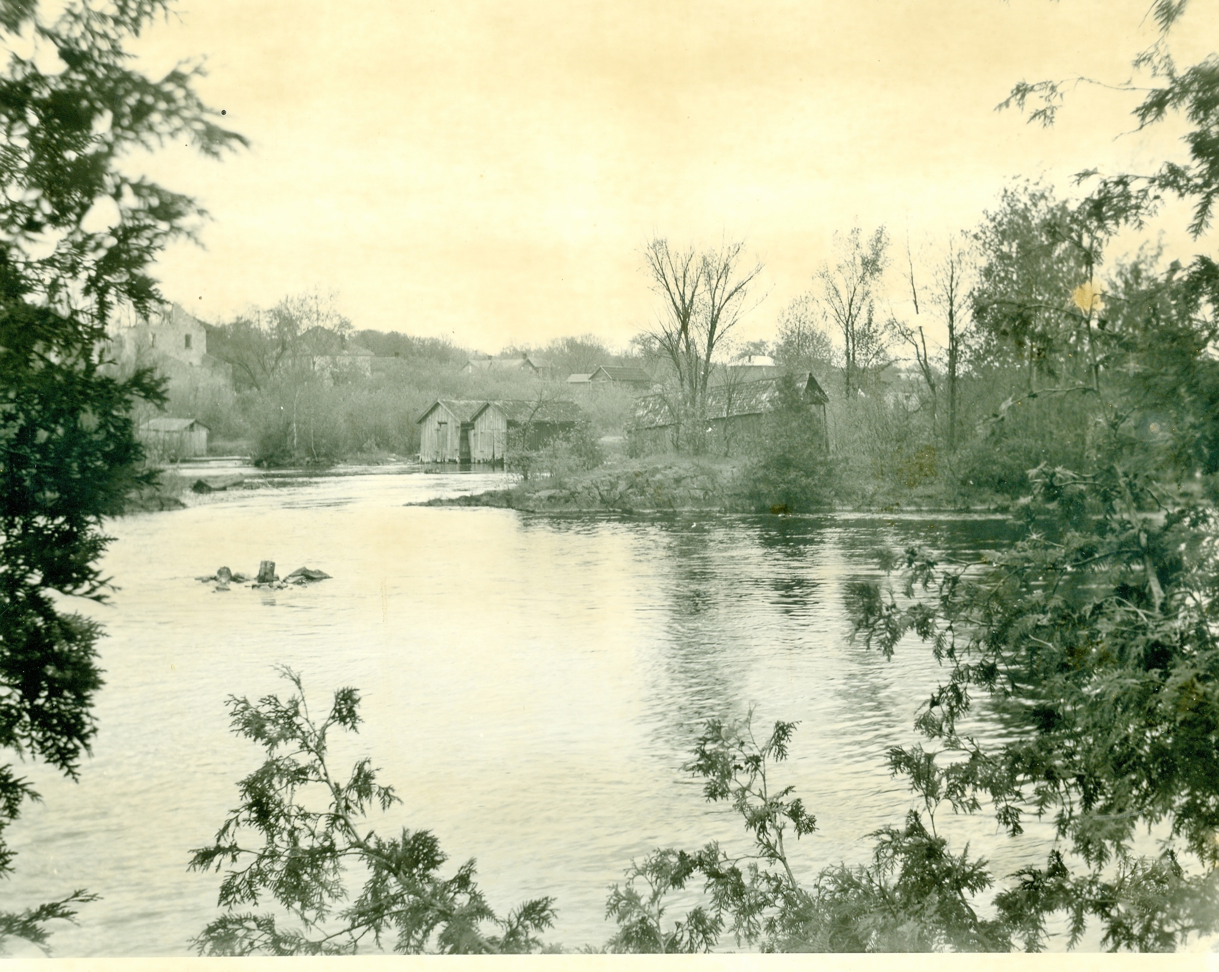 Earlier photo of the dam positioned to the north of present location