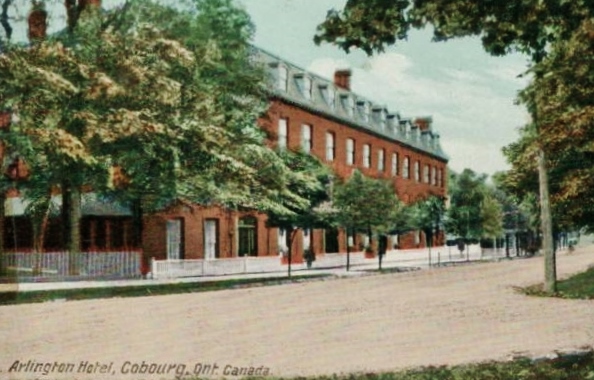 Arlington Hotel, c. 1915, built by George Shoenberger and William Chambliss, was the first of many Cobourg hotels designed to cater to affluent Americans. It contained 150 rooms, of which 120 were bedrooms with private parlours. It had a dining room, bar, games room, parlour, commercial rooms and barber shop. c. 1910Was located on King Street East, opposite College Street. The building was demolished and the land is now part of Victoria Park