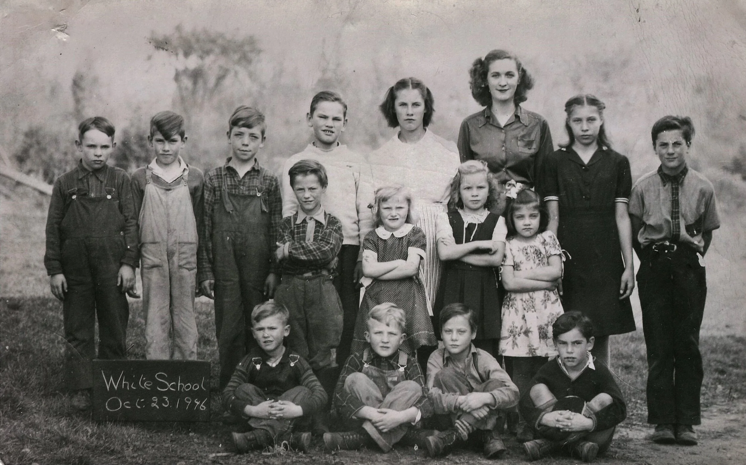 WHITE SCHOOL 1946. BACK ROW - 4TH BOY TO THE RIGHT JOHN "JACK" CLEMENS, DOROTHY HULSMANS, TEACHER, UNKNOWN GIRL, LEO HULSMANS (MY DAD) AT THE END STANDING. 2ND ROW BOY STANDING: DAVID HULSMANS, BESIDE HIM JEAN HULSMANS. FRONT ROW SITTING 3RD BOY HENRY HULSMANS. John Clemens is front row far right.
