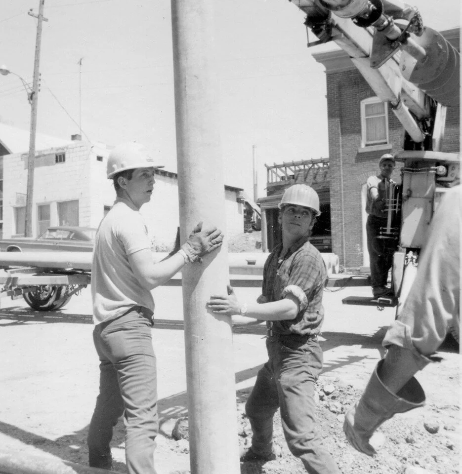 Ken Bonter, unknown Rusty Shackleton on crane, Neal's Dairy in back.jpg