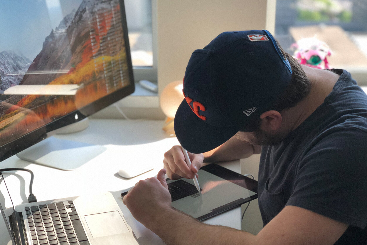 Graphic designer Jon Thompson making a custom illustration by hand on an iPad Pro with an Apple Pencil