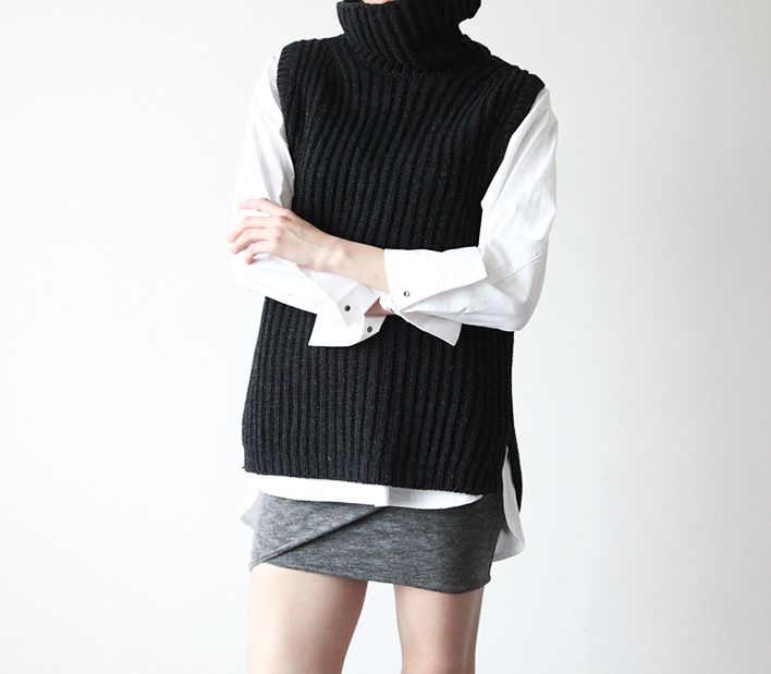 A knit turtleneck with no sleeves. 