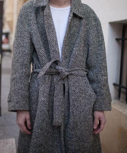 A wrap tweed jacket . 