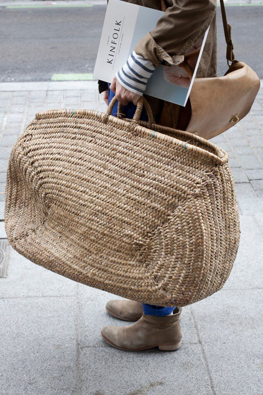 An oversized basket bag for weekend getaways. . 