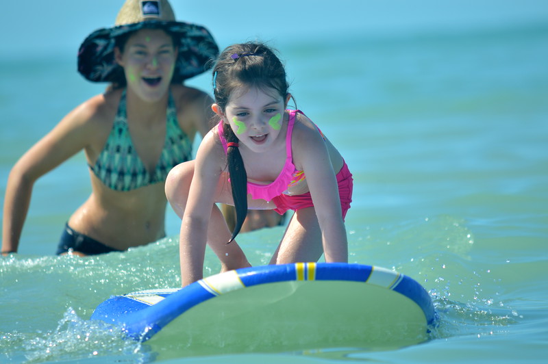 Campers learn to surf during Gator Babies Week.
